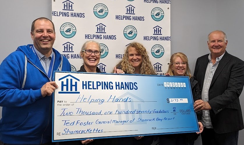 The Rockettes and other members of the Shamrock Bay resort community donated over $2,000 to Helping Hands after a summer and fall of fun community activities. From left: Helping Hands Executive Director Doug Rawson, Rocketttes Alison Wellington, Simmone Schepp, Marisa Rogucki and Ted Foster, general manager of Shamrock Bay Resort. 